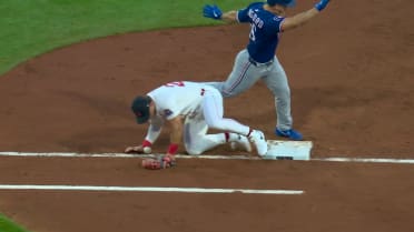 Wyatt Langford safe at first after challenge